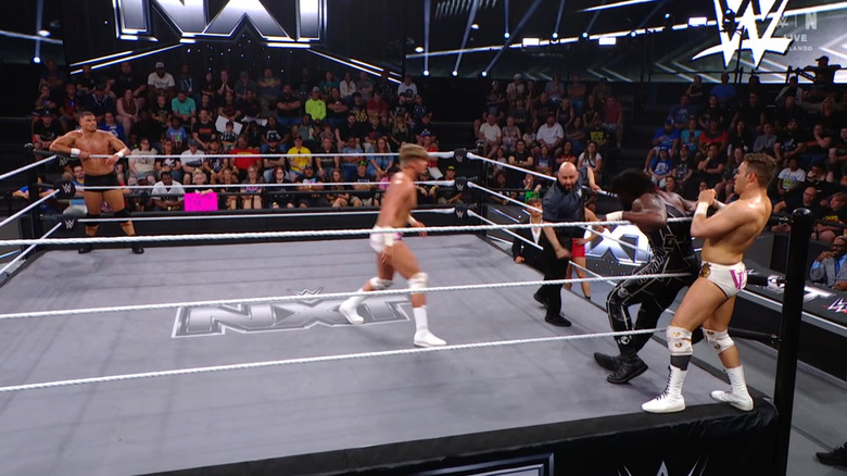 All four men in and around the ring