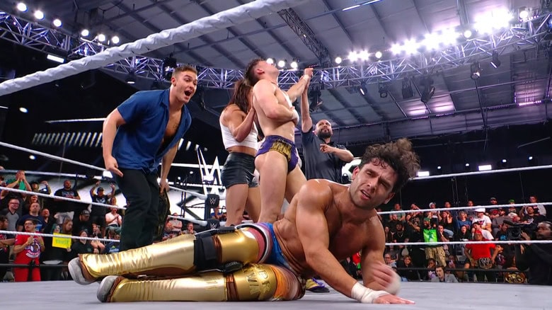 Vanity Project standing over Dar in the ring
