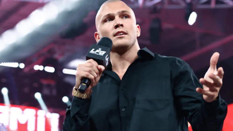Myles Borne holding a microphone