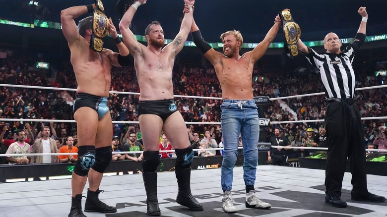 The Conglomeration celebrate in the ring