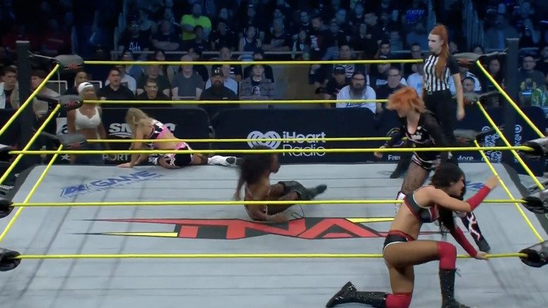 All four women in and around the ring