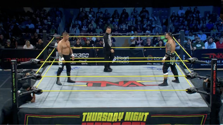 Maclin and Santana staring down one another in the ring