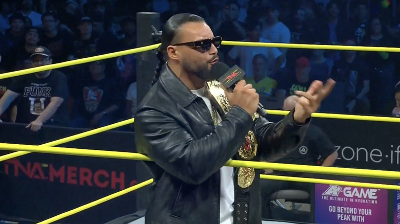 Santana talking in the ring