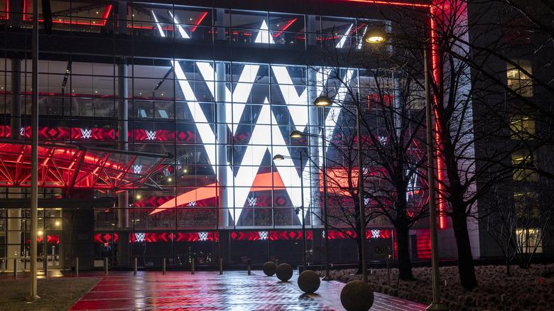 A giant WWE logo shines from the WWE world headquarters on January 28, 2024 in Stamford, Connecticut. WWE founder Vince McMahon resigned from the WWE and its parent company TKO as executive chairman and board of directors following allegations of sexual assault in a Connecticut lawsuit. A former employee Janel Grant accused McMahon, 78, of sexual assault and sexually trafficking her.