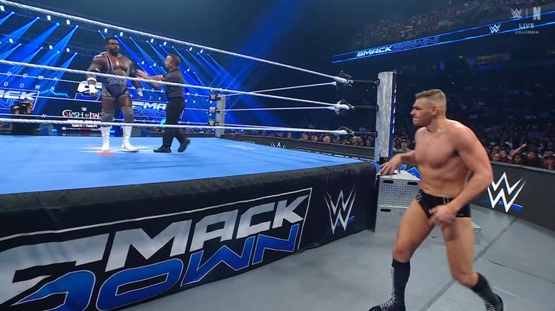 GUNTHER on the outside and Keys in the ring
