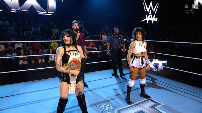 Paxley and Rain inside the ring during the ring announcement