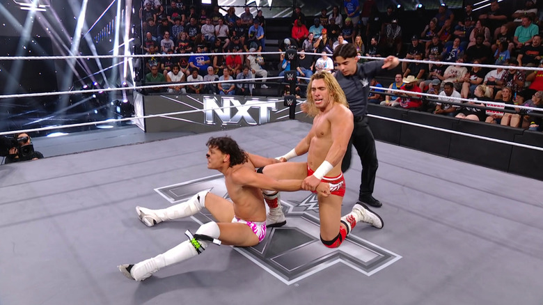 Angels wearing down Moreno with a shoulder submission