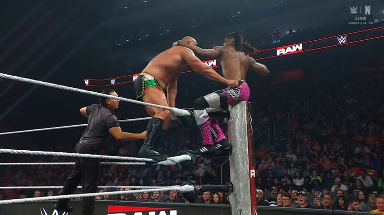 Rusev and Evans teetering on the ropes