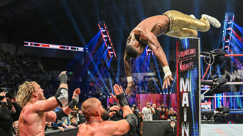 Montez Ford leaps over the ringpost