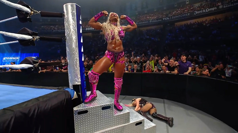 Cargill standing over Bliss on the ring steps