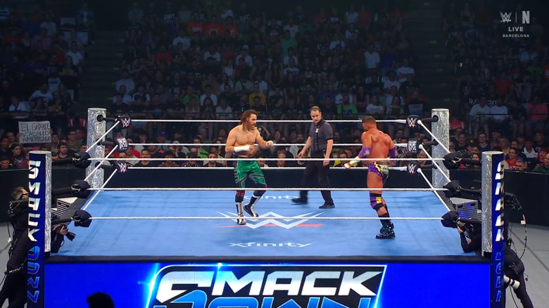 Zayn and Cardona staring down one another in the ring