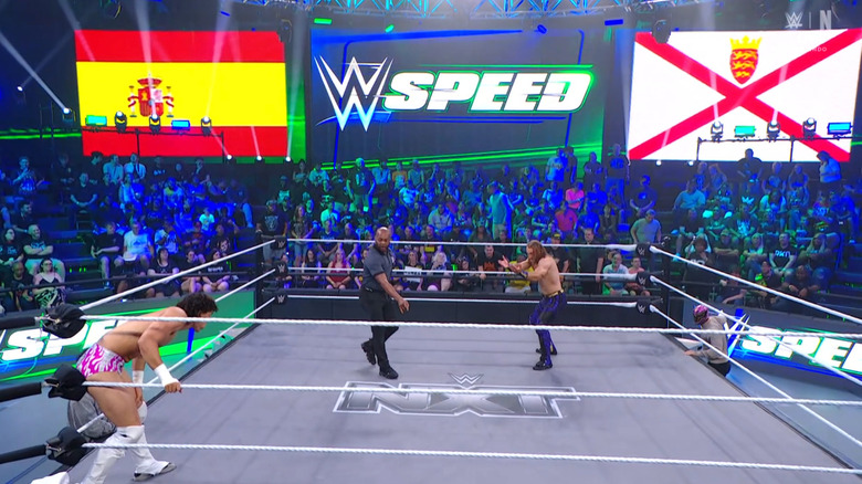 Both men in the ring staring down one another