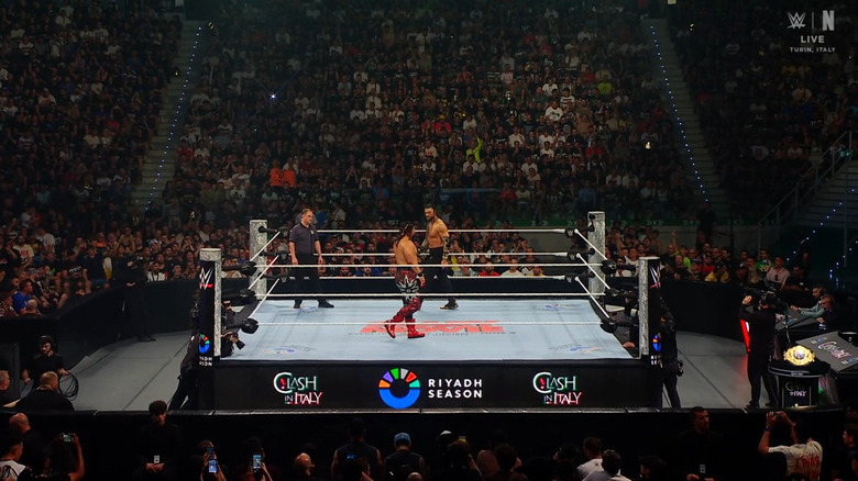 Fatu and Reigns staring down one another in the ring