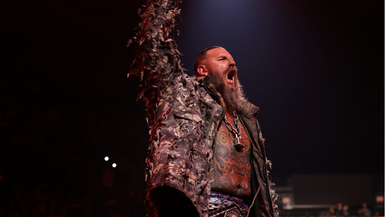 King raising his hand in the ring