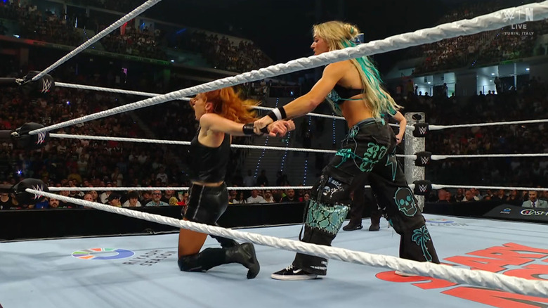 Ruca about to send Lynch crashing into the middle turnbuckle face first.