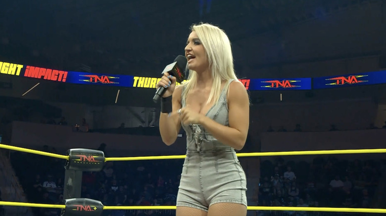 Brookside standing in the ring speaking