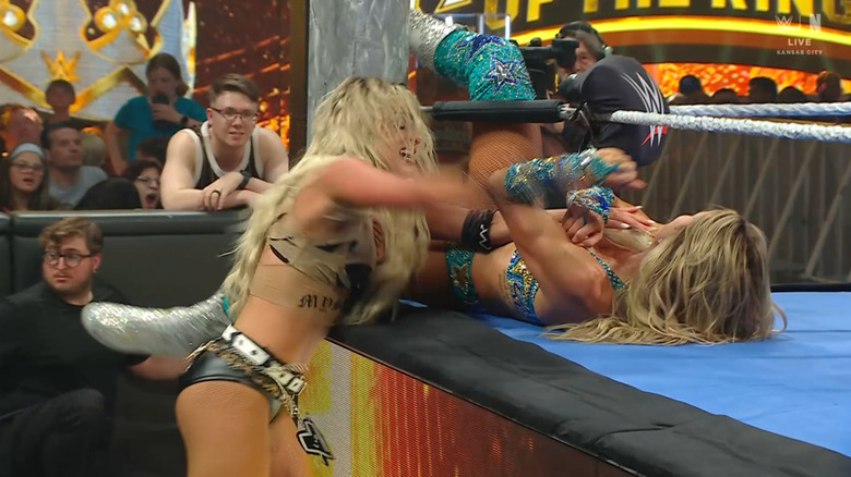 Morgan and Flair brawling in the corner of the ring