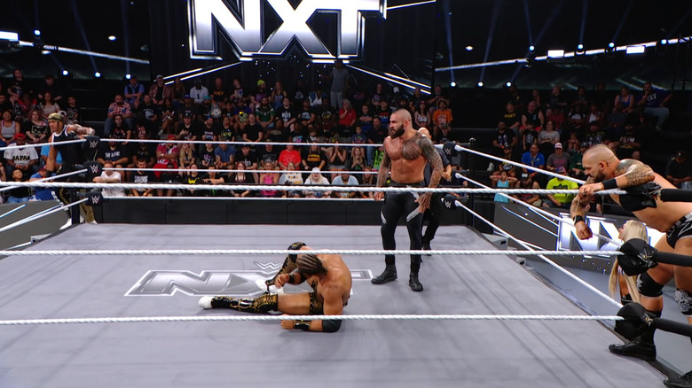 All four men in and around the ring
