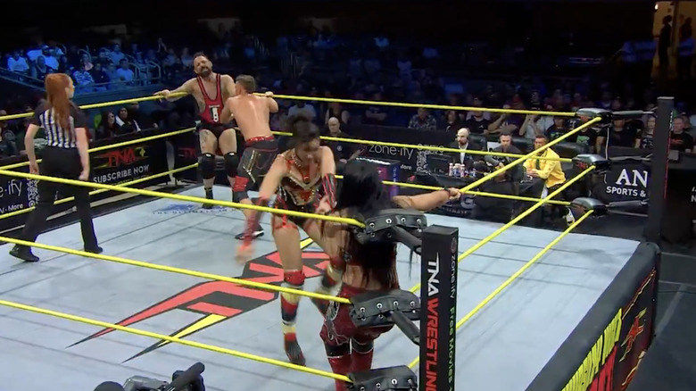 All four competitors inside the ring