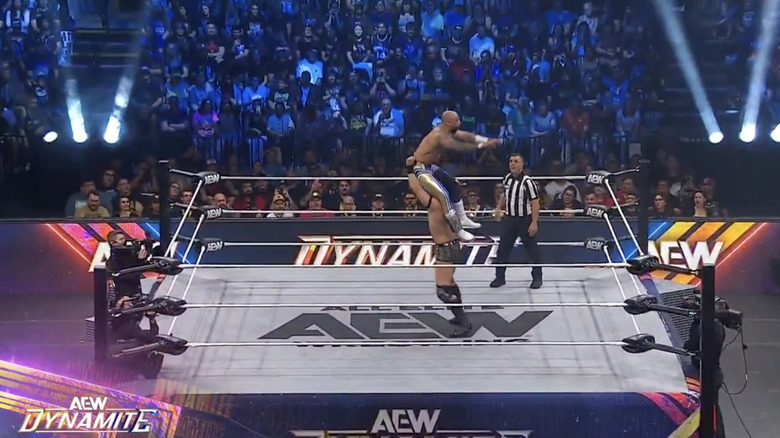 Takeshita setting up for a powerbomb on Ricochet