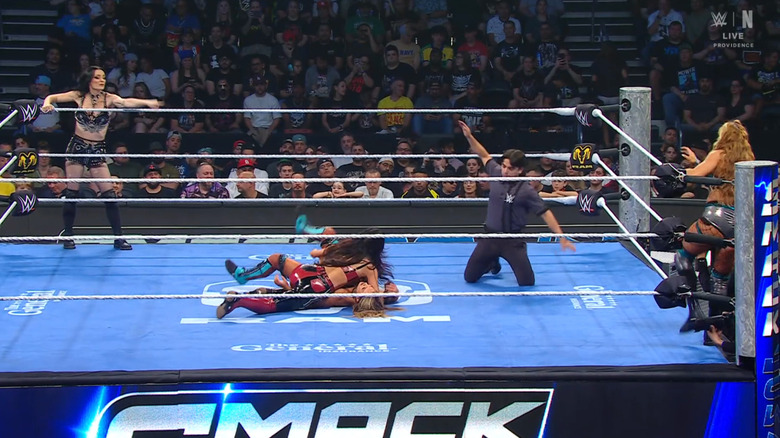 All four women in and around the ring