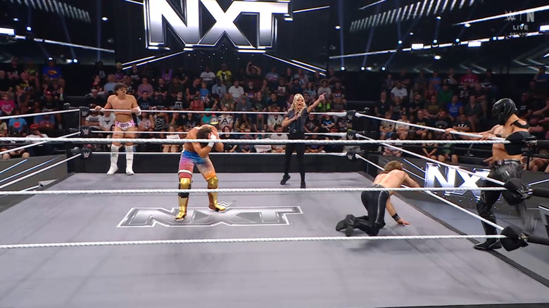 All four men in and around the ring