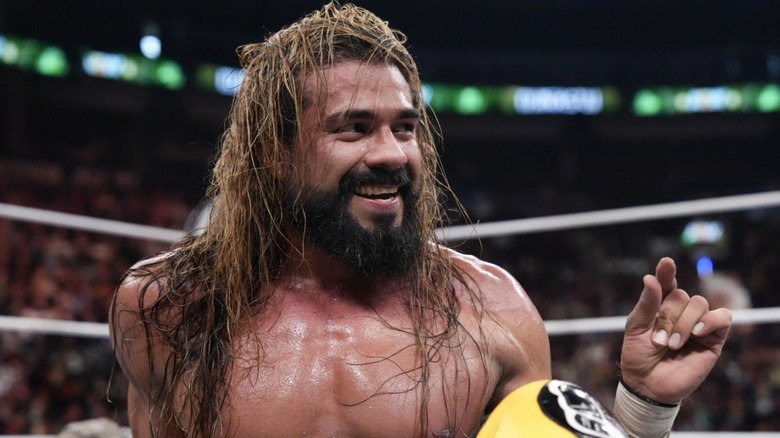 Andrade smiling in the ring