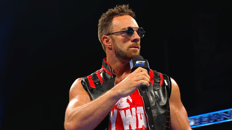 Knight in the ring with a microphone in hand