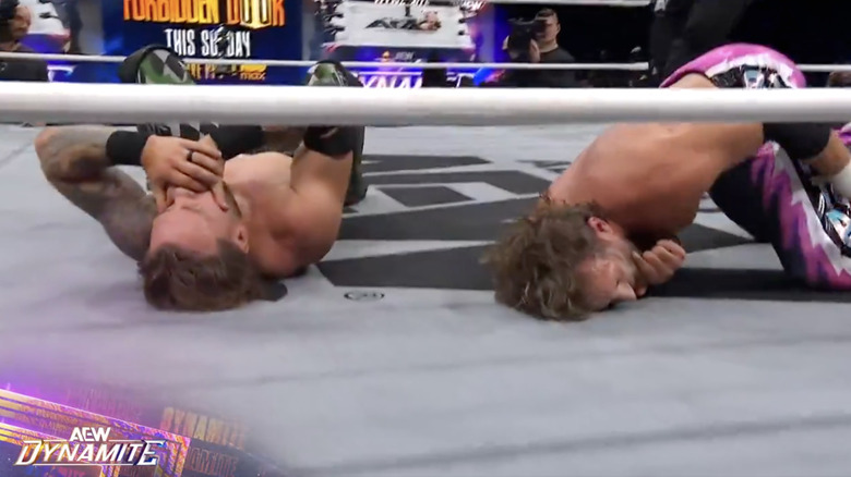 Ospreay and ELP both down in the ring