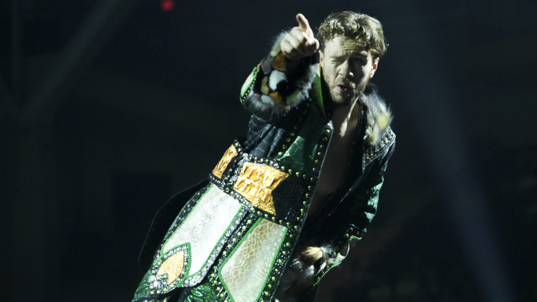 Ospreay posing on the turnbuckles
