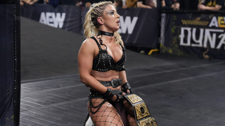 Thekla with her AEW Women's World Championship kneeling at the bottom of the entrance ramp