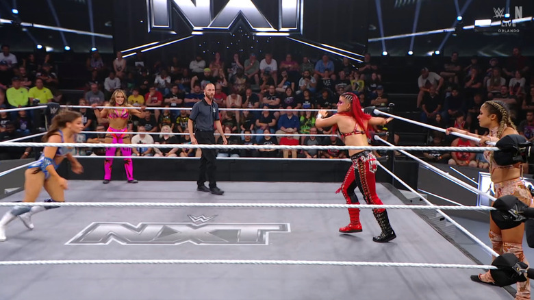 All four women in and around the ring