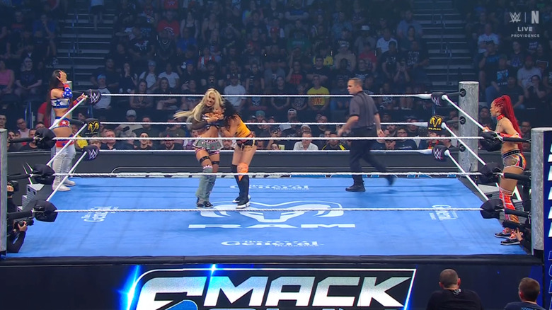 All four women in and around the ring