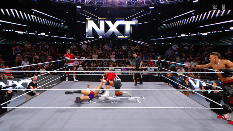 All four men in and around the ring