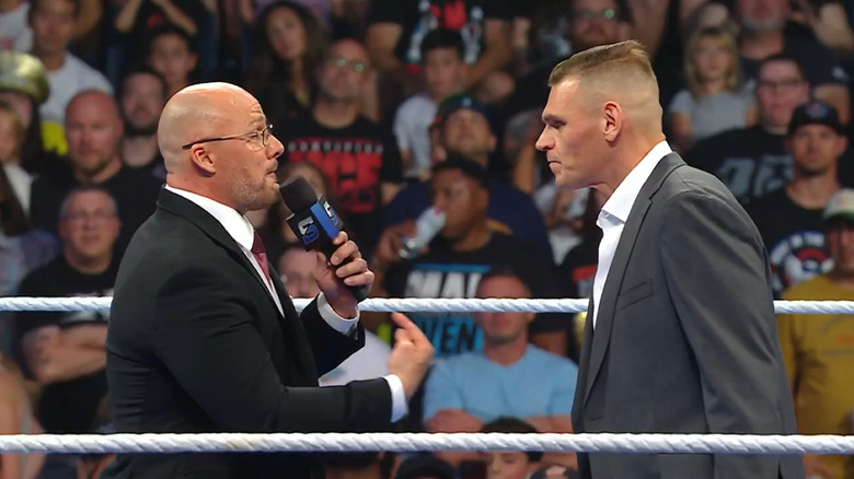 Gunther and Adam Pearce in the ring