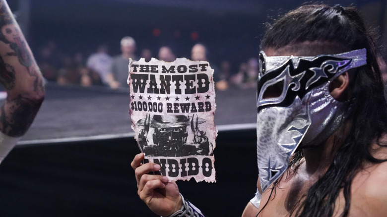 Bandido at ringside with his wanted poster