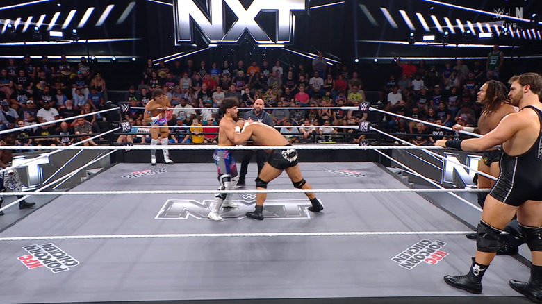All six men in and around the ring