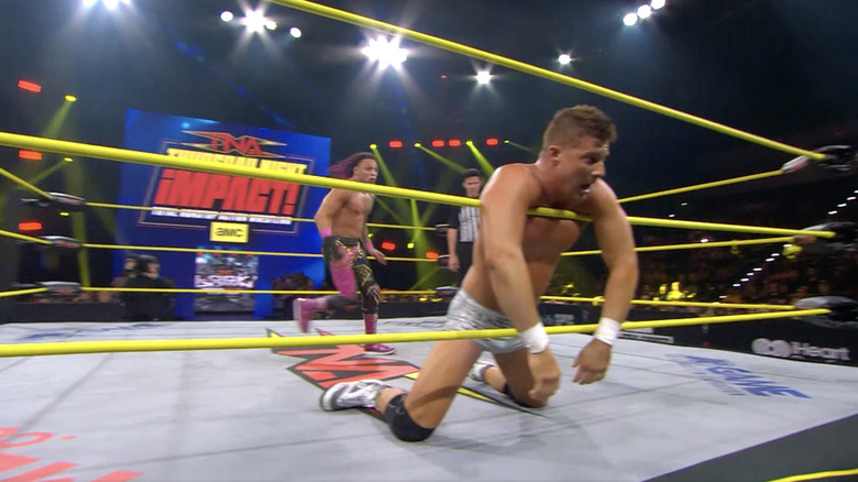 Navarro behind Ryan in the ring