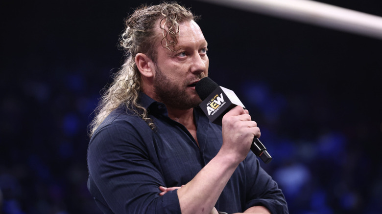 Omega talking on the microphone