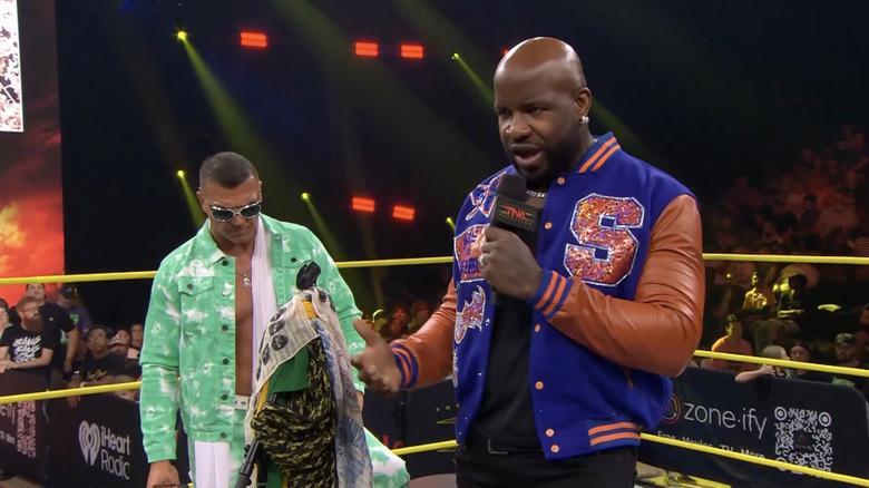 Kazarian and Moose both in the ring talking to one another
