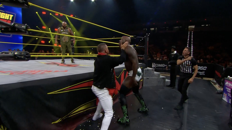 Kazarian beating down Moose on the outside as Francis is in the ring