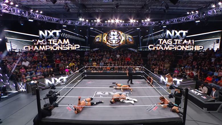 All four men down in the ring