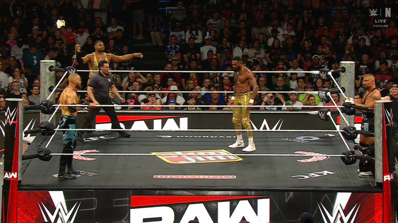 The four men in and around the ring