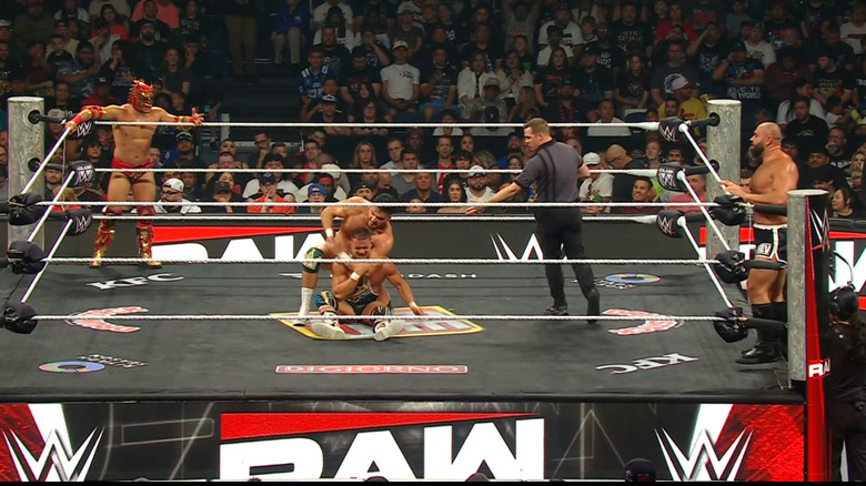 All four men inside and around the ring