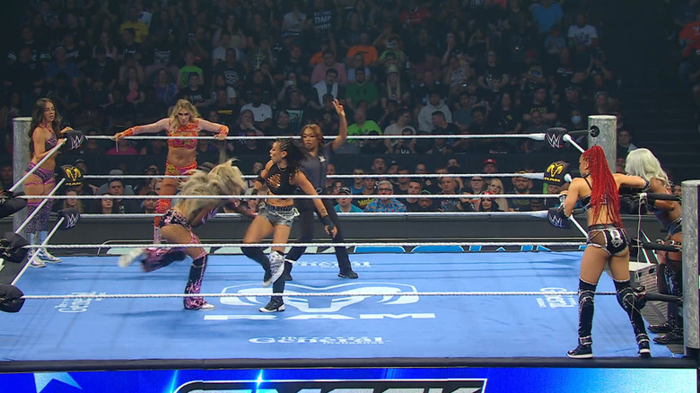 All six women in and around the ring
