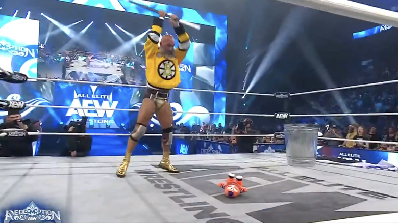 Ciampa about to hit Youppi with the hockey stick