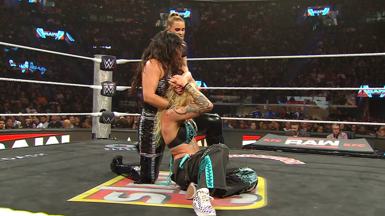 Rodriguez wearing down Ruca in the ring with a submission hold