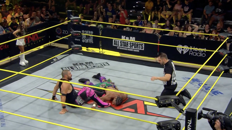 Eddie and Slater both down in the ring