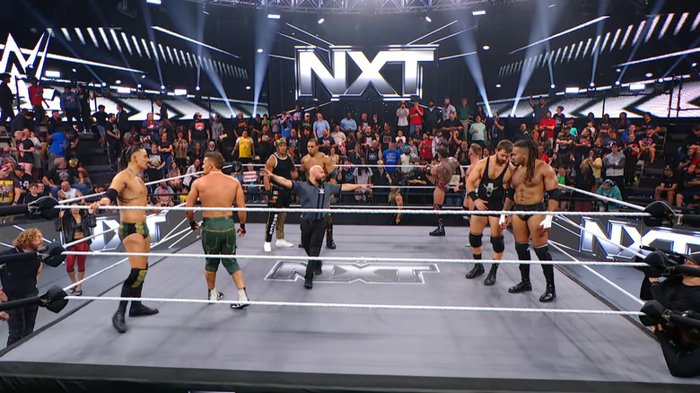 All four teams inside the ring