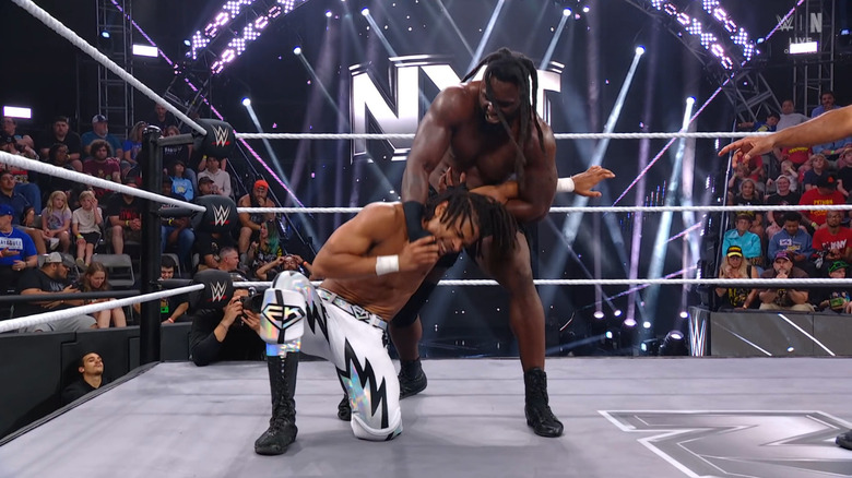 Carver wearing down Prosper with a submission hold